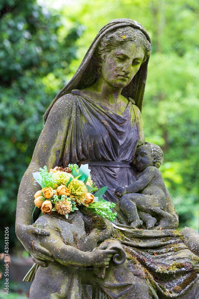 Historic Statue on the spring mystery old Prague Cemetery, Czech Republic