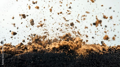 Dirt and soil are being thrown up, showcasing earth texture and movement.