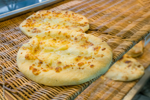 Khachapuri in Megrelian style on display at a kiosk (mini-cafe)