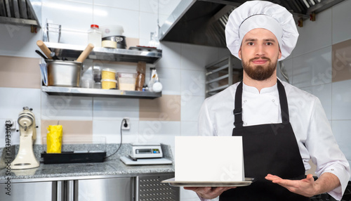 Male chef in uniform and ap...