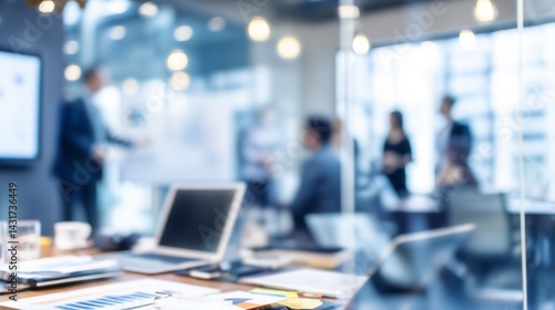 Wallpaper Mural A blurred image of a modern office where a group of business people are giving a presentation. Torontodigital.ca