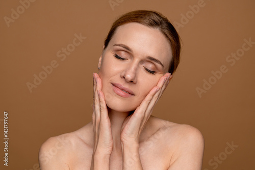 Photography Shot of of happy good-looking middle age woman with beautiful skin smiling at ca