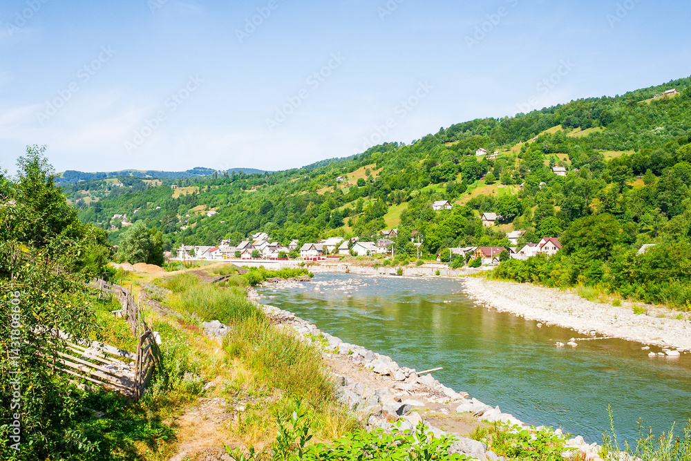 tisza river running through the valley. beautiful view. sunny weather in summer. mountainous countryside landscape of rakhiv region in ukraine. meandering stream