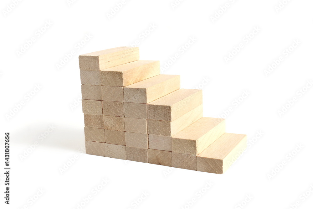 On a white background there are wooden blocks stacked in a ladder. On a white background there are wooden blocks stacked in a ladder.