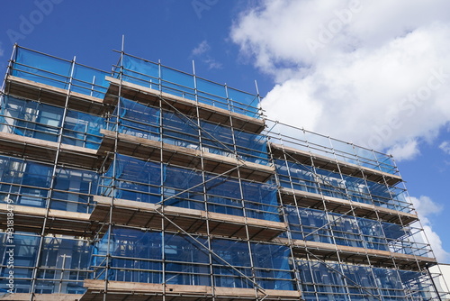 building under construction with scaffolding. construction industry