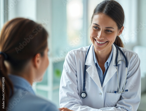 The image shows a smiling female doctor wearing a white lab coat and a stethoscope, engaged in a conversation with a patient