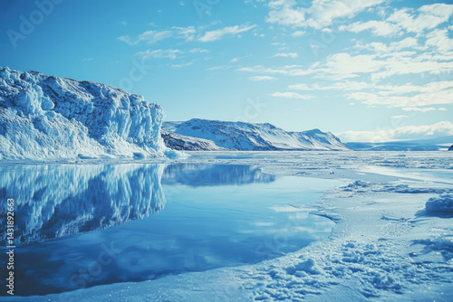 Wallpaper Mural Serene glacial landscape reflecting in calm icy waters under a bright blue sky. Torontodigital.ca