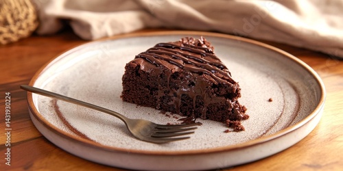 Obraz na płótnie A delicious slice of chocolate cake on a rustic plate. The cake is rich and topped with smooth chocolate drizzle. Perfect for dessert lovers and special occasions. Enjoy this delightful treat. AI w salonie
