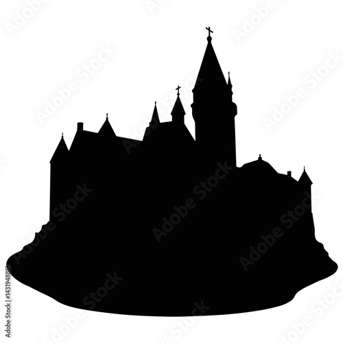 Silhouette of a castle on a hilltop at dusk  