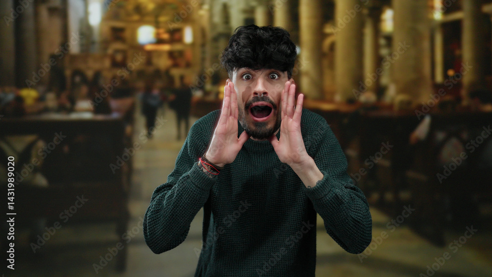Young man with surprised expressions in a historical church setting, wearing a sweater, showcasing emotions amid a blurred indoor backdrop.