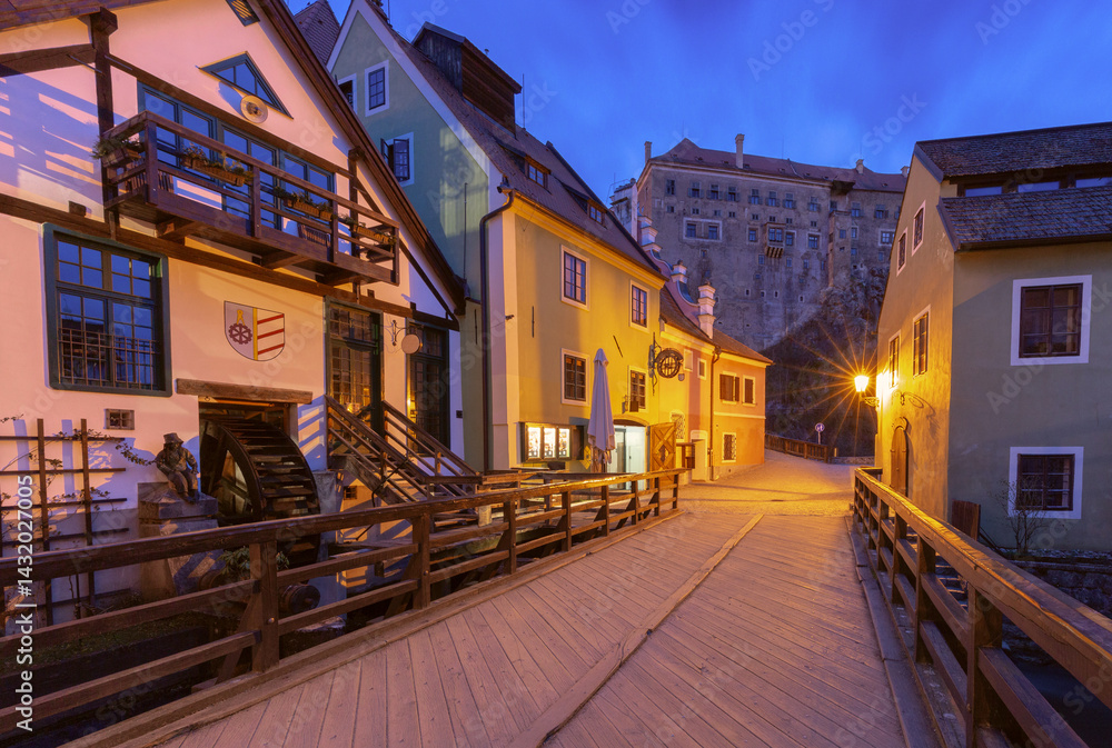 Evening view of a cobbled street with historic buildings in Cesky Krumlov, Czech Republic