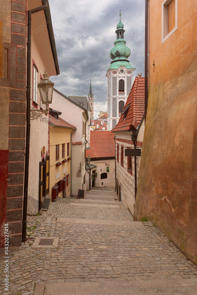 Evening view of a cobbled street with historic buildings in Cesky Krumlov, Czech Republic
