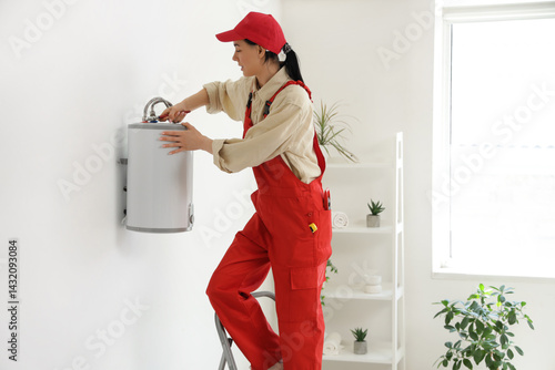 Female worker with wrench i...