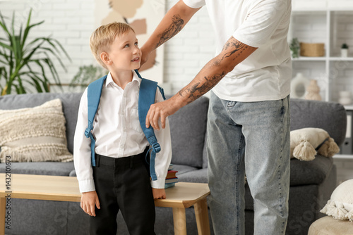 Father adjusting his little...