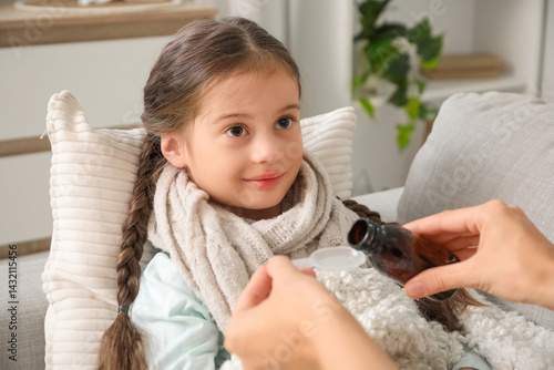 Sick little girl with her m...