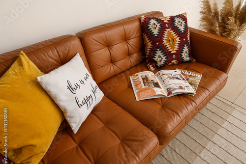 Brown leather sofa with sof...