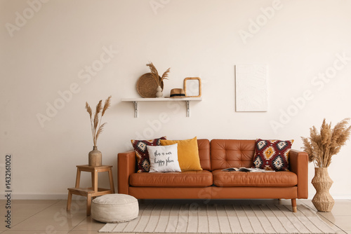 Brown leather sofa with sof...