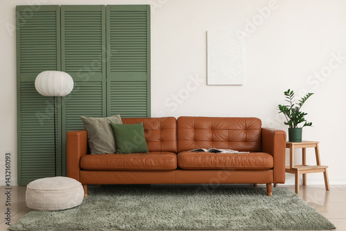 Brown leather sofa with sof...