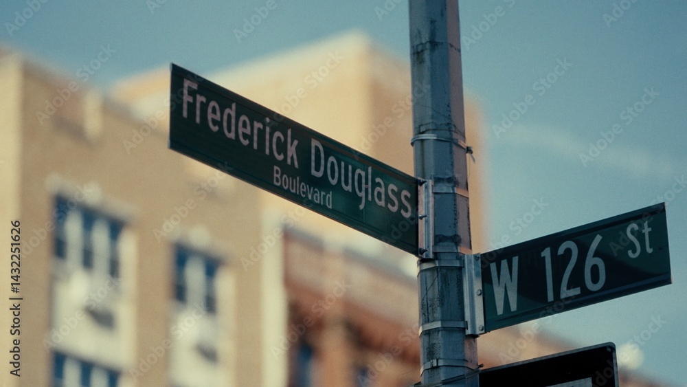 Fototapeta premium Street signs indicating Frederick Douglass Boulevard and West 126th Street in Manhattan, New York City