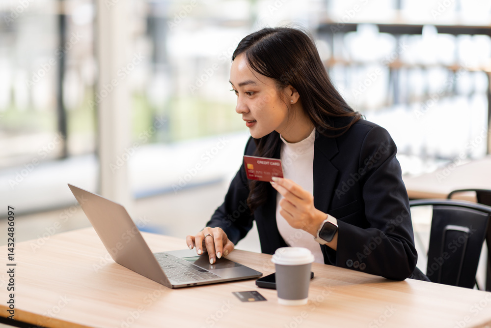 Fototapeta premium Transfer money online business asian woman using bank payment card. Hands input credit card data using phone and laptop.