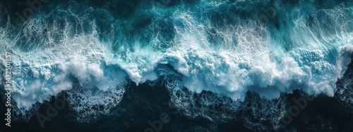 Aerial view of crashing ocean waves, showcasing the beauty and power of nature.