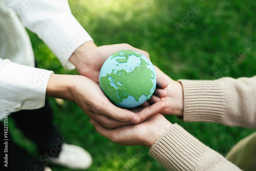 Fototapeta Naklejka Na Ścianę i Meble -  World Environment Day, hands holding earth globe to protect and save clean planet, Environmental care for sustainable.Green Business Save Earth and Eco Friendly. ESG and CSR concept to net zero
