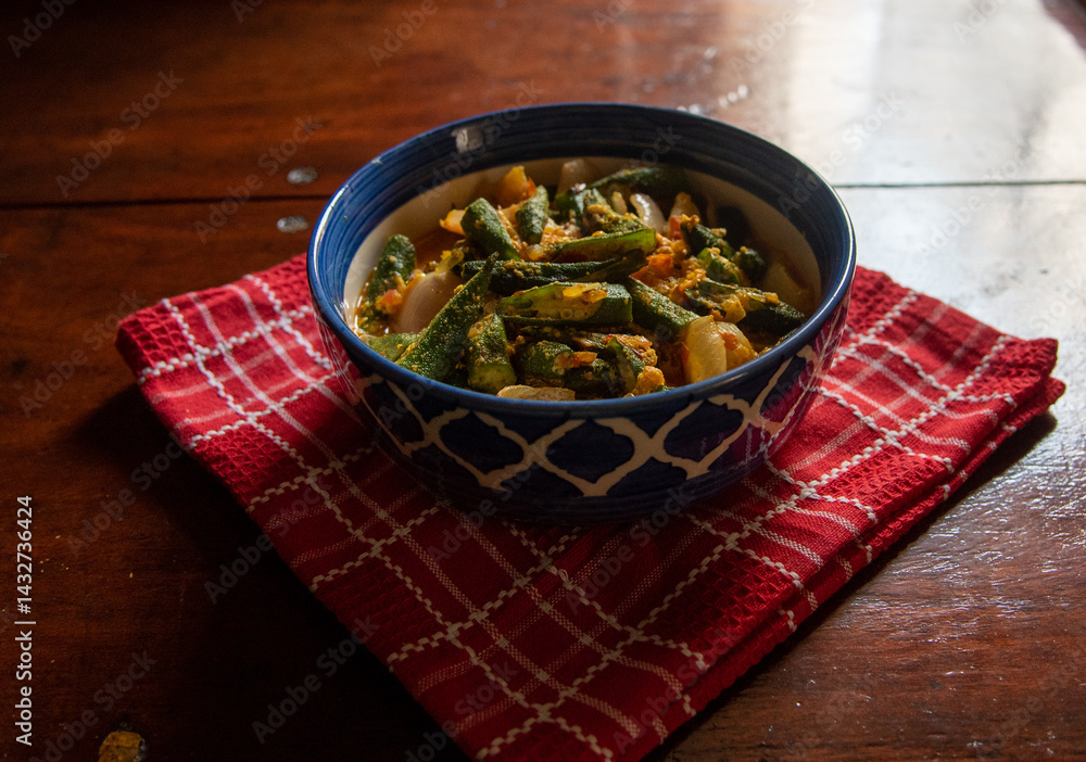 Bhindi masala or Okra made with yogurt and Indian spices served in a bowl.