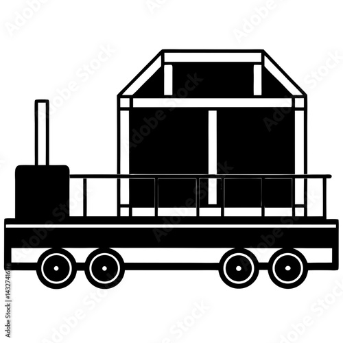 Silhouette of a train cart with cargo being loaded
