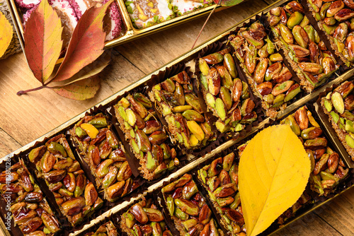 Obraz na płótnie Sweet food Turkish delight on wooden background, assorted locum and pistachio candy for decorated backdrop w salonie