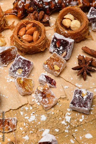 Sweet food Turkish delight on wooden background, assorted locum and candy for decorated backdrop