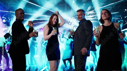 Group Of People Dancing At Night Club Party