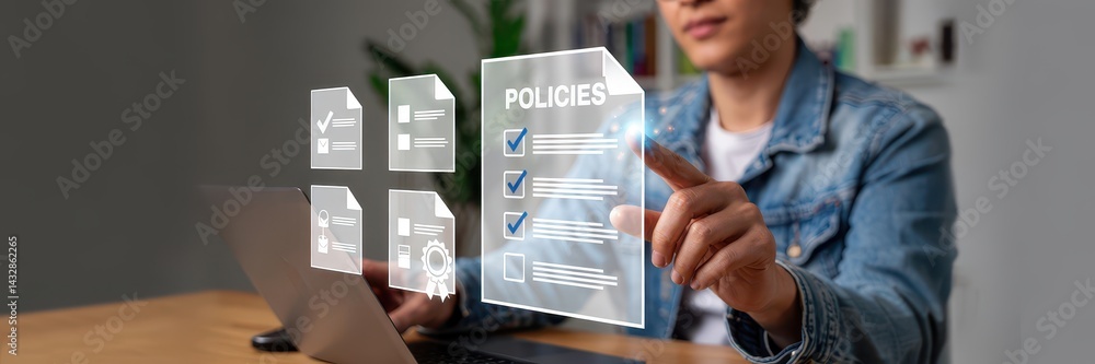 Person reviewing digital policies on a laptop.