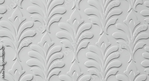 A repeating pattern of stylized floral and leaf motifs is subtly embossed on a white surface, creating an elegant texture.