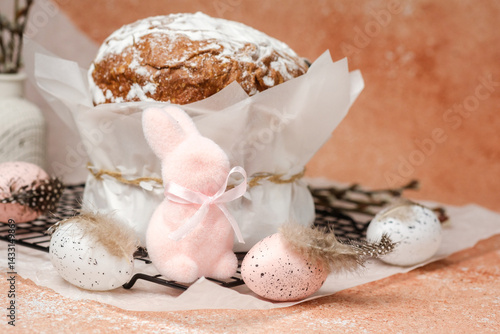 Obraz na płótnie Easter celebration composition with traditional cake, pastel speckled eggs and decorative pink bunny. Spring holiday scene... w salonie