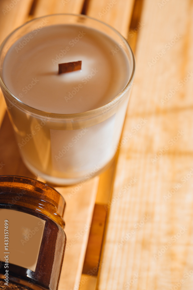 Scented candles on a wooden table.