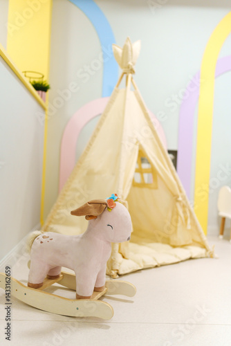 Obraz na płótnie Wigwam tent for children's room with rocking toy. w salonie