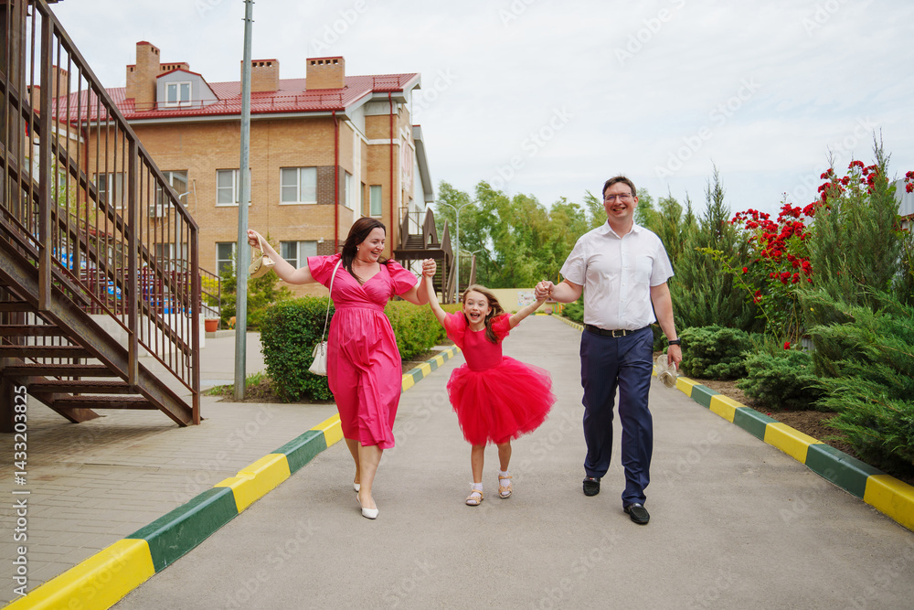 Happy well-dressed family on a walk.