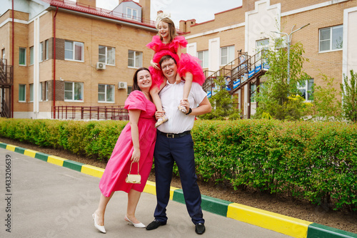 Happy well-dressed family on a walk. 