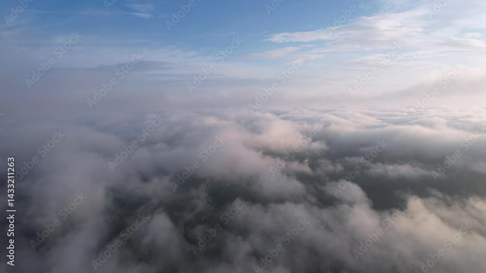 Explore the beauty of high-altitude clouds in a misty blue sky with serene white formations at dawn Explore the beauty of high-altitude clouds in a misty blue sky with serene white formations at dawn