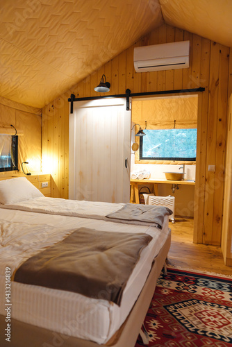 Obraz na płótnie Bedroom interior in glamping. A cozy tent house. w salonie
