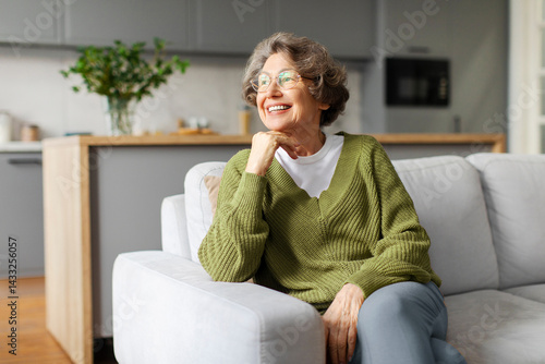 Canvastavla Happy dreamy senior woman looking aside deep in pleasant memories and smiling, s