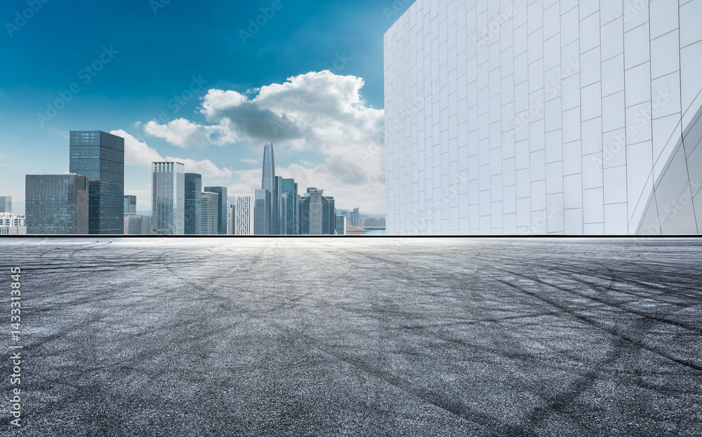 Asphalt road and city skyline with modern buildings scenery