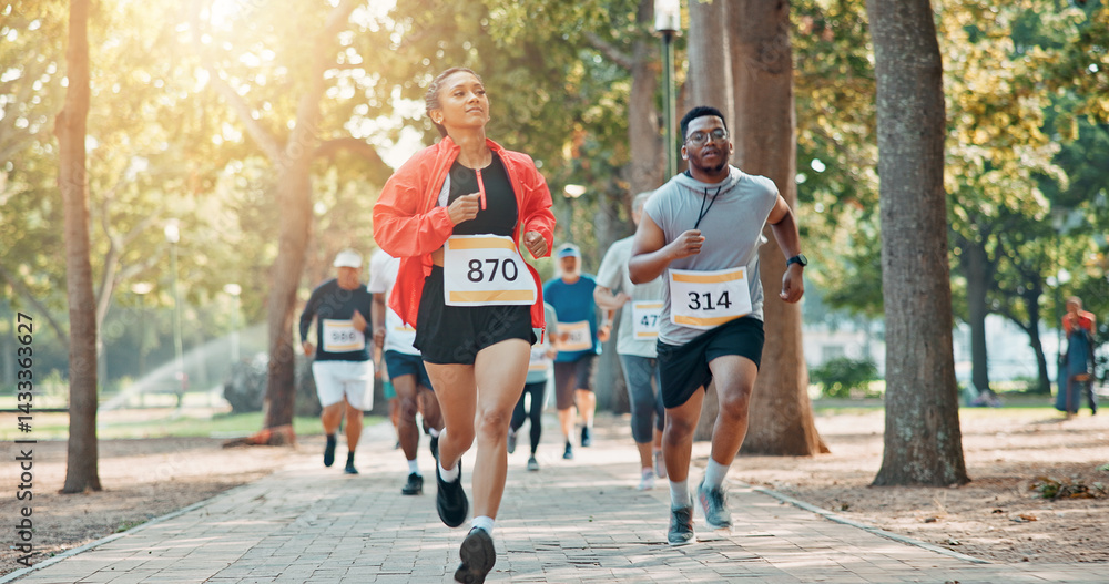 Fototapeta premium Running, marathon and speed with people in park for charity event, health challenge or fitness. Performance, fundraising competition and exercise with group of runners in nature for workout and sport