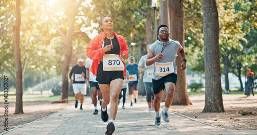 Running, marathon and speed with people in park for charity event, health challenge or fitness. Performance, fundraising competition and exercise with group of runners in nature for workout and sport