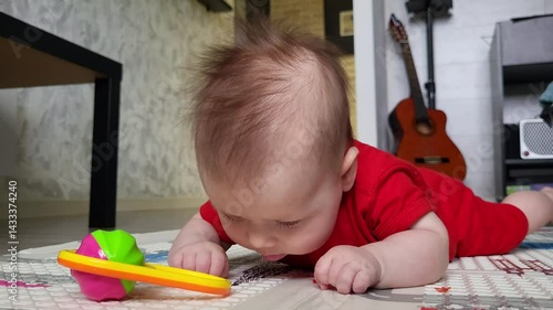 A Four-Month-Old Girl Is Looking Into The Camera Lens