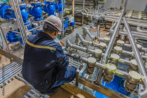 Male work inspection process stainless steel pipe stainless with pressure meter in equipment tank facility for drink cellar at the with vertical stainless valve