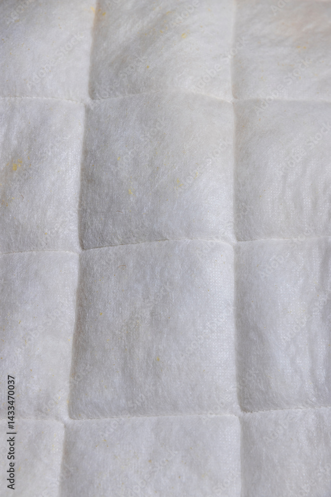 part of the fabric from which the mattress is sewn after prolonged use