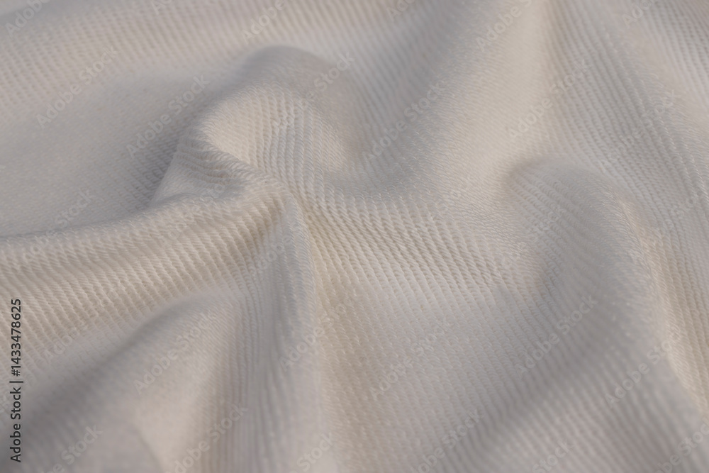 Crumpled material for the production of clothing and other items, white natural cotton yarn material closeup