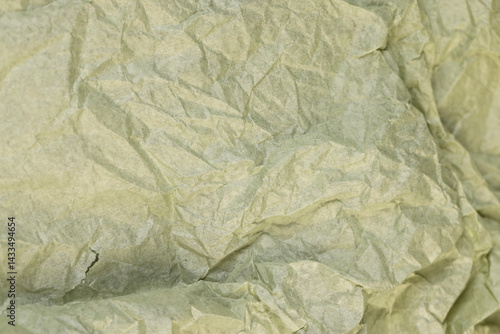 Obraz na płótnie green paper for packaging , part of a sheet of paper crumpled after use w salonie