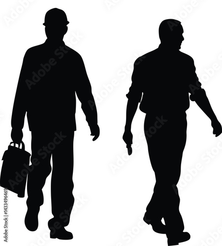 A silhouette of a construction worker walking